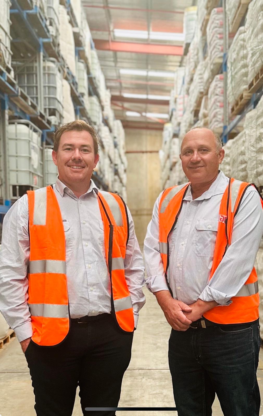 Chris Drew and Darren Kidson in the Rural Inputs warehouse